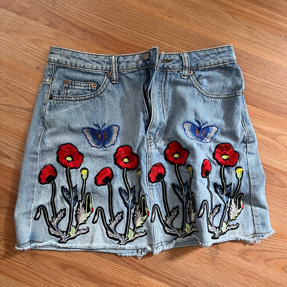 Signature Denim Skirt with Red Floral and Blue Butterfly Embroidery